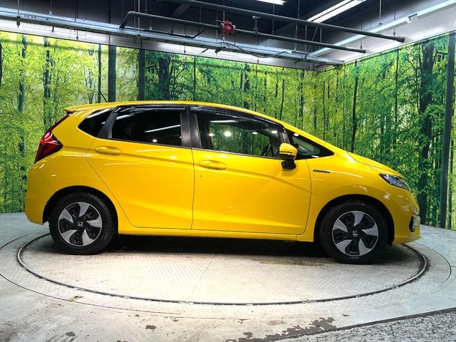 フィットハイブリッド Ｌ　ホンダセンシング　禁煙車　純正ＳＤナビ　バックカメラ　衝突被害軽減システム　ハーフレザーシート　スマートキー　ＬＥＤヘッド　ビルトインＥＴＣ　車線逸脱警報　オートライト　オートエアコン　Ｂｌｕｅｔｏｏｔｈ　ＣＤ（29枚目）