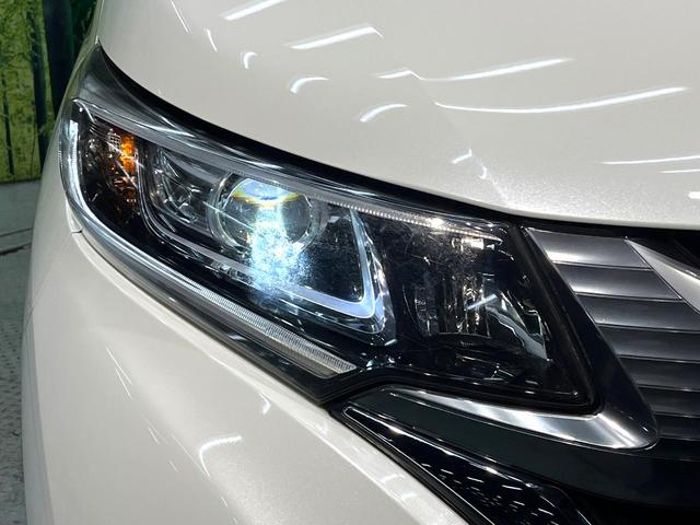 フリードハイブリッド ハイブリッド・ＥＸ　禁煙車　両側電動スライドドア　後席モニター　衝突軽減システム　アダプティブクルーズ　純正９インチナビ　バックカメラ　フルセグ　ＥＴＣ　ｂｌｕｅｔｏｏｔｈ再生　シートヒーター　ＬＥＤヘッド　スマートキー（32枚目）