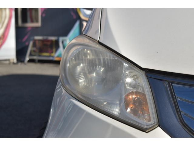 フリードハイブリッド ジャストセレクション　スマートキー　純正ＨＤＤナビ　ベンチシート　オートエアコン　バックカメラ　左側パワースライドドア　社外ホイール　７人乗りフリップダウンモニター　ＥＴＣ（13枚目）