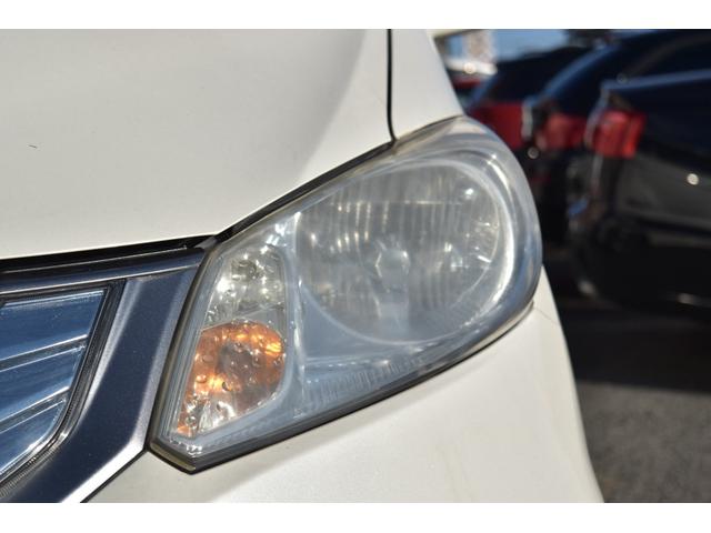 フリードハイブリッド ジャストセレクション　スマートキー　純正ＨＤＤナビ　ベンチシート　オートエアコン　バックカメラ　左側パワースライドドア　社外ホイール　７人乗りフリップダウンモニター　ＥＴＣ（14枚目）