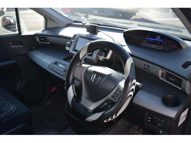 フリードハイブリッド ジャストセレクション　スマートキー　純正ＨＤＤナビ　ベンチシート　オートエアコン　バックカメラ　左側パワースライドドア　社外ホイール　７人乗りフリップダウンモニター　ＥＴＣ（16枚目）