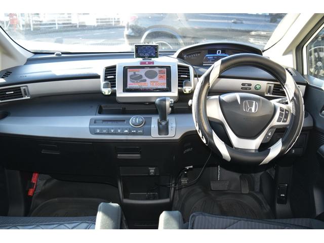 フリードハイブリッド ジャストセレクション　スマートキー　純正ＨＤＤナビ　ベンチシート　オートエアコン　バックカメラ　左側パワースライドドア　社外ホイール　７人乗りフリップダウンモニター　ＥＴＣ（29枚目）