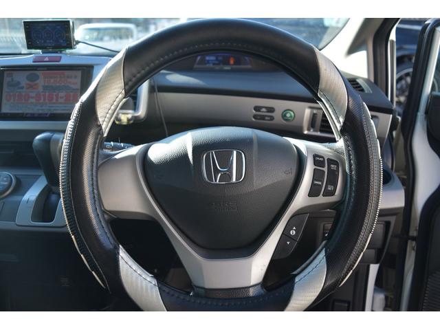 フリードハイブリッド ジャストセレクション　スマートキー　純正ＨＤＤナビ　ベンチシート　オートエアコン　バックカメラ　左側パワースライドドア　社外ホイール　７人乗りフリップダウンモニター　ＥＴＣ（30枚目）