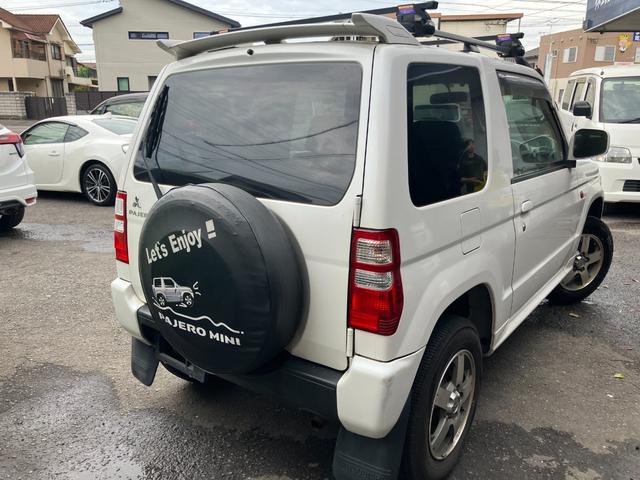 パジェロミニ ナビエディションＶＲ　４ＷＤ　インタークーラーターボ　ＴＥＲＺＯルーフラック　禁煙車　ＨＤＤナビフルセグＴＶ　ＥＴＣ　ミュージックキャッチャー　キーレス　背面タイヤ　取扱説明書　整備点検記録簿（16枚目）
