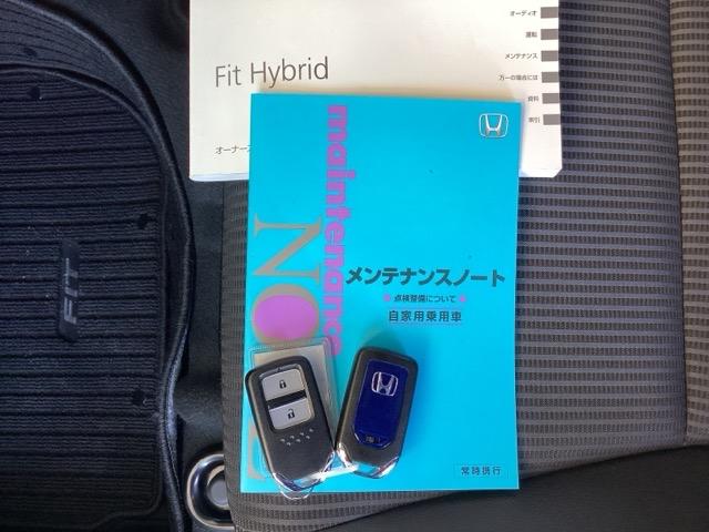 フィットハイブリッド Lホンダセンシング 純正ナビ フルセグ リアカメラ 軽減ブレーキ Rカメ LED サイドSRS 横滑り防止 ナビTV パワーステアリング 盗難防止装置 オートクルーズ ETC車載器 DVD再生 ABS 助手席エアバッグ(22枚目)