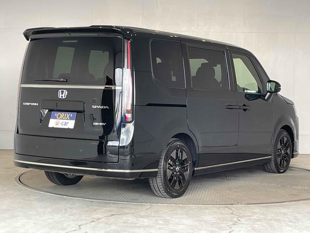 ステップワゴン e:HEVスパーダ CMBS レーンキープ BSI Pセンサー ACC 両側パワスラ LEDヘッド フォグ 純正16アルミ デュアルAAC シートヒーター Pバックドア 純正ナビ フルセグTV BT バックカメラ(2枚目)