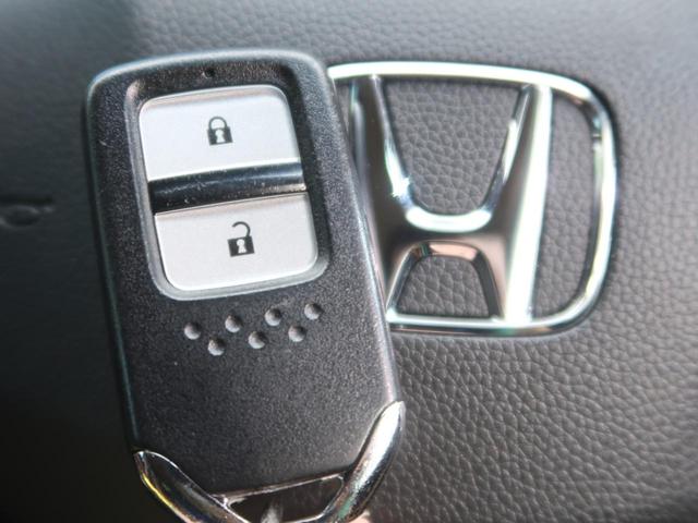 ハイブリッドZ・ホンダセンシング 純正8型ナビ ホンダセンシング/レーダークルーズ 禁煙車 LEDヘッド/フォグ バックカメラ ハーフレザー/シートヒーター Bluetooth接続 左右独立オートエアコン 純正17AW(59枚目)