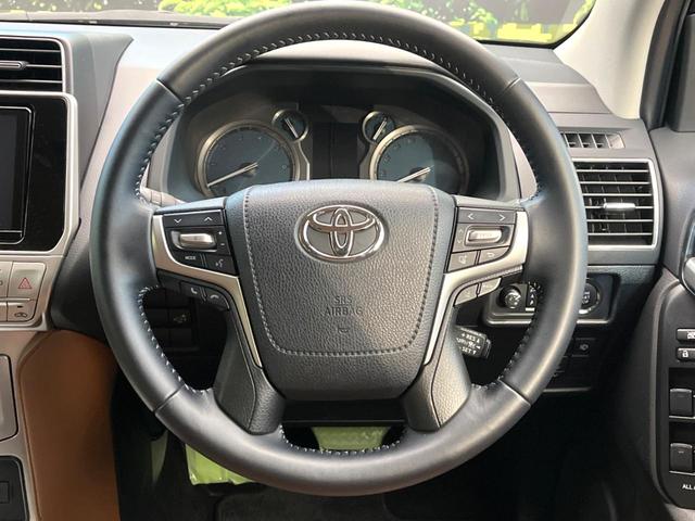 ランドクルーザープラド TX Lパッケージ 70thアニバーサリーリミテッド 禁煙車 サンルーフ 4WD メーカー純正9インチナビ バックカメラ プリクラッシュセーフティ レーダークルーズ 茶革シート シートヒーター LEDヘッド スマートキー 純正18インチアルミ(12枚目)