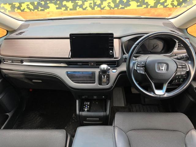 オデッセイハイブリッド ｅ：ＨＥＶアブソルート・ＥＸ　両側電動ドア　後席モニター　ホンダセンシング　レーダークルーズコントロール　電動リアゲート　コーナーセンサー　全周囲カメラ　ＥＴＣ２．０　ドラレコ　スマートキー　ＬＥＤヘッド　車線逸脱防止（2枚目）