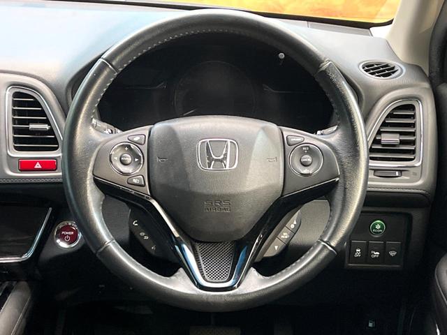 ヴェゼル ハイブリッドＺ　禁煙車　純正ＳＤナビ　バックカメラ　衝突被害軽減システム　ハーフレザーシート　スマートキー　ＬＥＤヘッド　ビルトインＥＴＣ　クルコン　純正１７インチアルミ　オートライト　デュアルエアコン（11枚目）