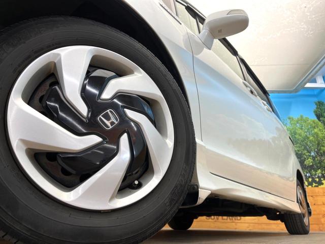 フリードハイブリッド ハイブリッド　プレミアムエディション　両側電動ドア　純正ＳＤナビ　バックカメラ　ハーフレザーシート　ドラレコ　スマートキー　ＨＩＤヘッド　ビルトインＥＴＣ　クルコン　オートライト　オートエアコン　ＣＤ　ＤＶＤ再生　地デジ（14枚目）