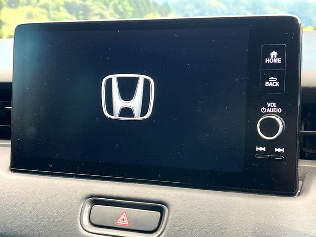 ヴェゼル ｅ：ＨＥＶ　Ｚ　禁煙車　純正９インチナビ　バックカメラ　ホンダセンシング　シートヒーター　ブラインドスポットモニター　レーダークルーズ　電動リアゲート　コーナーセンサー　パドルシフト　ＬＥＤヘッド　ＥＴＣ（3枚目）
