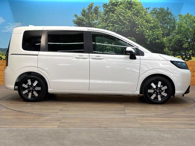 フリード ｅ：ＨＥＶエアー　ＥＸ　登録済未使用車　両側電動ドア　衝突被害軽減システム　レーダークルーズ　コーナーセンサー　スマートキー　ＬＥＤヘッド　純正１５インチアルミ　車線逸脱警報　オートライト　デュアルエアコン（27枚目）