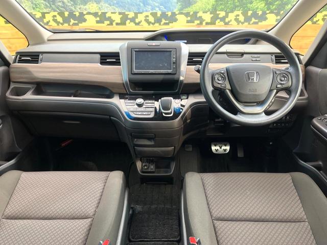 フリードハイブリッド ハイブリッド・Ｇホンダセンシング　禁煙車　両側電動ドア　純正ＳＤナビ　バックカメラ　衝突被害軽減システム　レーダークルーズ　ドラレコ　コーナーセンサー　スマートキー　ＬＥＤヘッド　ビルトインＥＴＣ　純正１５インチアルミ　車線逸脱警報（2枚目）