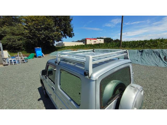 ジムニー ワイルドウインド　パートタイム４ＷＤ　５ＭＴ　ラジオ　エアコン　フォグランプ　パワーステアリング　背面スペアタイヤ　ドアザイザー　ルーフキャリア　取扱説明書（23枚目）