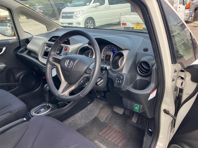 フィットハイブリッド スマートセレクション ハイブリッド オートクルーズコントロール オートライト HID スマートキー 電動格納ミラー CVT レンタカーアップ 盗難防止システム 衝突安全ボディ CD USB ABS エアコン(54枚目)