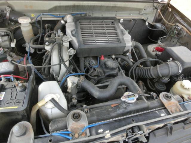 キックス RX 4WD ターボ 5MT リフトアップ公認 マッドタイヤ MKWアルミホイール オーバーフェンダー JAOSアンダーガード JAOSマッドフラップ 社外マフラー (ブラック)(8枚目)