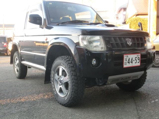 キックス RX 4WD ターボ 5MT リフトアップ公認 マッドタイヤ MKWアルミホイール オーバーフェンダー JAOSアンダーガード JAOSマッドフラップ 社外マフラー (ブラック)(10枚目)