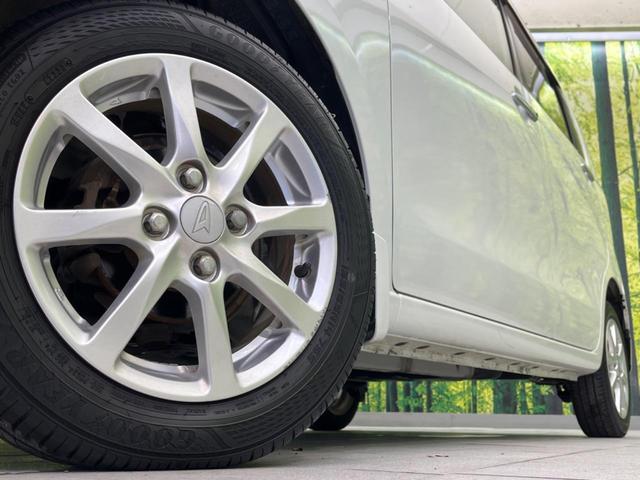 ムーヴ Xリミテッド 禁煙車 純正ナビ バックカメラ ETC ドライブレコーダー スマートキー 純正14インチアルミホイール アイドリングストップ 盗難防止装置 CD再生 オートエアコン ベンチシート(13枚目)