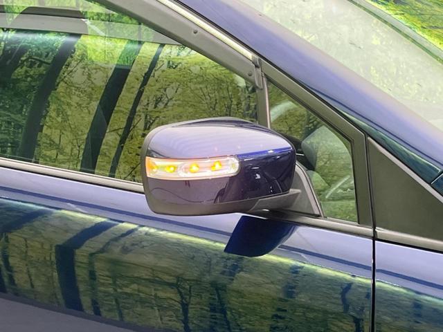 MPV 23S 両側電動スライドドア 禁煙車 純正ナビ ETC バックカメラ スマートキー HIDヘッドライト 革巻きステアリング ステアリングスイッチ オートエアコン 純正17インチアルミホイール オットマン(21枚目)