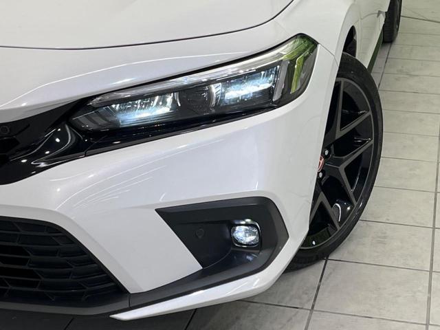 シビック ｅ：ＨＥＶ　衝突軽減装置　禁煙車　純正９インチナビ　ＢＯＳＥサウンド　アダプティブクルーズ　バックカメラ　ＥＴＣ　Ｂｌｕｅｔｏｏｔｈ　フルセグ　ドライブレコーダー　シートヒーター　パワーシート（12枚目）