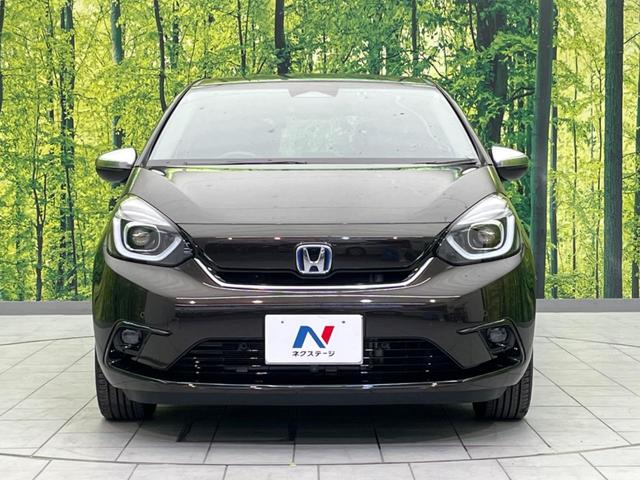 フィット ｅ：ＨＥＶリュクス　衝突軽減装置　禁煙車　９型ナビ　バックカメラ　ドラレコ　ＥＴＣ　レーダークルーズコントロール　クリアランスソナー　スマートキー　レーンアシスト　オートマチックハイビーム　オートエアコン（14枚目）