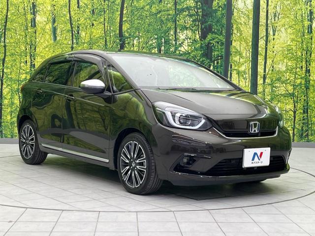 フィット ｅ：ＨＥＶリュクス　衝突軽減装置　禁煙車　９型ナビ　バックカメラ　ドラレコ　ＥＴＣ　レーダークルーズコントロール　クリアランスソナー　スマートキー　レーンアシスト　オートマチックハイビーム　オートエアコン（16枚目）