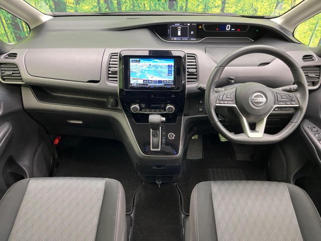 セレナ ハイウェイスターＶ　両側電動スライドドア　ＳＤナビ　後席モニター　全周囲カメラ　衝突軽減装置　禁煙車　ドラレコ　コーナーセンサー　レーンキープ　スマートキー　ＬＥＤヘッド　ＥＴＣ　クルーズコントロール　オートライト（2枚目）