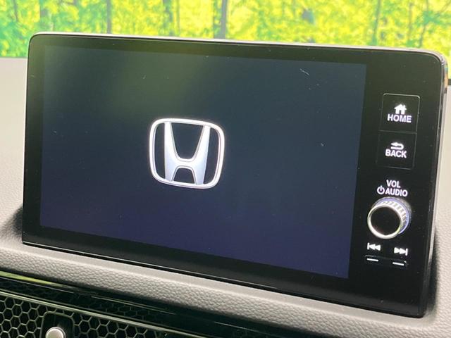 シビック ｅ：ＨＥＶ　純正９型ナビ　バックカメラ　ＢＯＳＥサウンドシステム　衝突軽減装置　レーダークルーズ　禁煙車　ハーフレザーシート　シートヒーター　パワーシート　ドラレコ　コーナーセンサー　レーンキープ　スマートキー（4枚目）