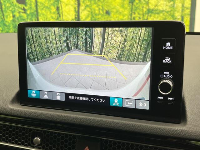 シビック ｅ：ＨＥＶ　純正９型ナビ　バックカメラ　ＢＯＳＥサウンドシステム　衝突軽減装置　レーダークルーズ　禁煙車　ハーフレザーシート　シートヒーター　パワーシート　ドラレコ　コーナーセンサー　レーンキープ　スマートキー（5枚目）