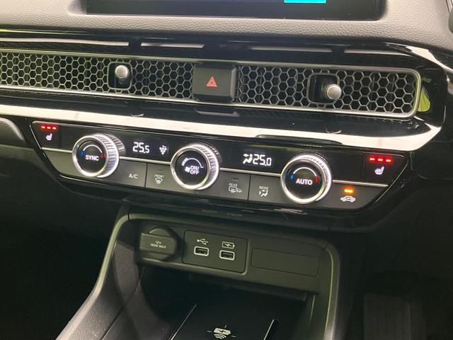 シビック ｅ：ＨＥＶ　純正９型ナビ　バックカメラ　ＢＯＳＥサウンドシステム　衝突軽減装置　レーダークルーズ　禁煙車　ハーフレザーシート　シートヒーター　パワーシート　ドラレコ　コーナーセンサー　レーンキープ　スマートキー（53枚目）