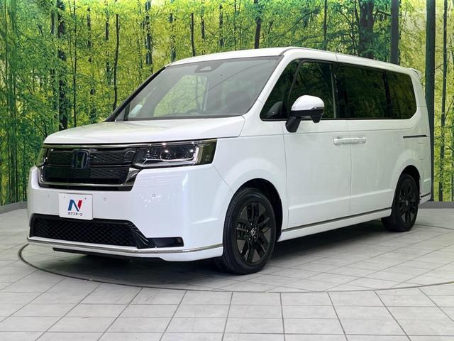 ステップワゴン ｅ：ＨＥＶスパーダ　両側電動スライドドア　衝突軽減装置　禁煙車　純正１１インチナビ　レーダークルーズ　バックカメラ　ＥＴＣ　Ｂｌｕｅｔｏｏｔｈ　シートヒーター　ハーフレザーシート　ＬＥＤヘッドライト　レーンキープアシスト（27枚目）