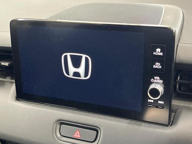 ヴェゼル ｅ：ＨＥＶ　Ｚ　純正９インチナビ　全周囲カメラ　衝突軽減装置　レーダークルーズ　禁煙車　ＬＥＤヘッドライト　ＥＴＣ　Ｂｌｕｅｔｏｏｔｈ再生　フルセグ　ドライブレコーダー　クリアランスソナー　オートマチックハイビーム（3枚目）