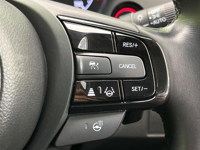 ヴェゼル ｅ：ＨＥＶ　Ｚ　純正９インチナビ　全周囲カメラ　衝突軽減装置　レーダークルーズ　禁煙車　ＬＥＤヘッドライト　ＥＴＣ　Ｂｌｕｅｔｏｏｔｈ再生　フルセグ　ドライブレコーダー　クリアランスソナー　オートマチックハイビーム（6枚目）