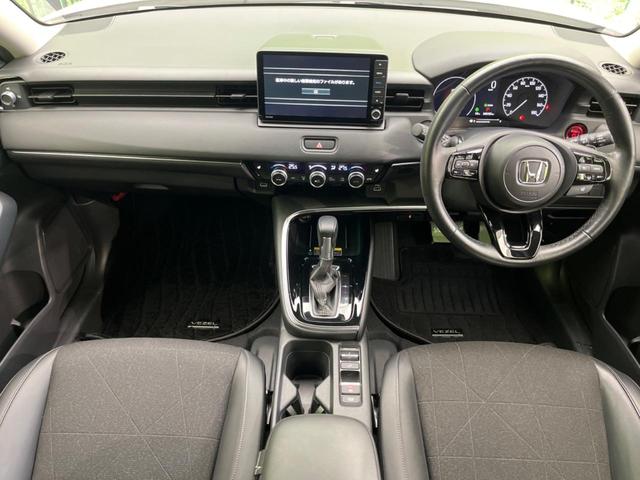 ヴェゼル ｅ：ＨＥＶ　Ｚ　ホンダセンシング　禁煙車　純正９インチナビ　アダプティブクルーズコントロール　バックカメラ　ＥＴＣ　Ｂｌｕｅｔｏｏｔｈ　フルセグ　ドライブレコーダー　スマートキー　シートヒーター　ハーフレザーシート（2枚目）