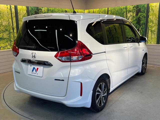 フリードハイブリッド ハイブリッド・ＥＸ　ホンダセンシング　メーカーナビ　フリップダウン　バックカメラ　両側電動ドア　アダプティブクルーズ　シートヒーター　ハーフレザーシート　ＬＥＤヘッド　純正１５アルミ　ドラレコ　ＥＴＣ　禁煙車（65枚目）