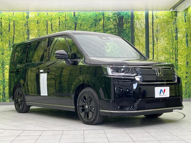 ステップワゴン スパーダ　未登録済未使用車　両側電動スライド　衝突軽減　純正１１．４インチ純正ナビ　バックカメラ　禁煙車　レーダークルーズ　スマートキー　ＬＥＤヘッド　シートヒータ　ハーフレザーシー（17枚目）