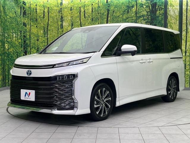 ヴォクシー ハイブリッドＳ－Ｚ　１４インチ後席モニター　両側電動スライドドア　衝突軽減装置　純正１０．５インチナビ　レーダークルーズコントロール　バックカメラ　ＥＴＣ２．０　フルセグ　シートヒーター　ハーフレザーシート　ＬＥＤヘッド（26枚目）