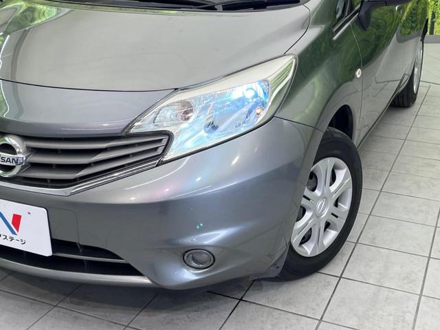 ノート Ｘ　純正ＳＤナビ　禁煙車　ドラレコ　ＥＴＣ　スマートキー　ＨＩＤヘッド　電動格納ミラー　ＣＤ再生　アイドリングストップ　盗難防止システム　プライバシーＧ　頸部衝突緩和ヘッドレスト（11枚目）