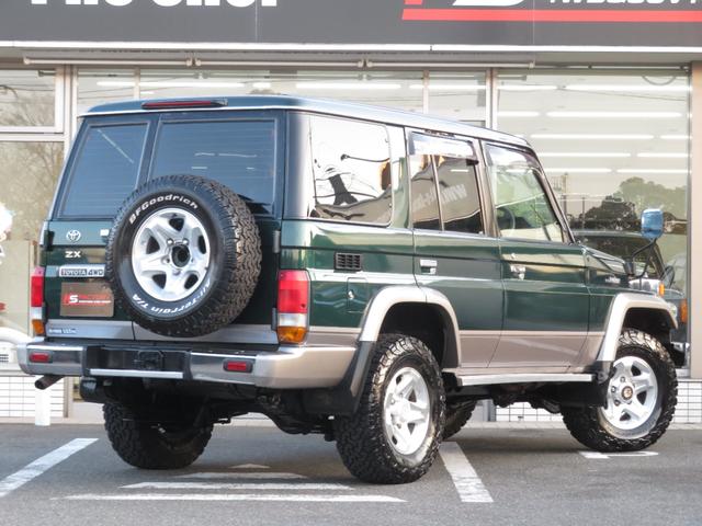 ランドクルーザー７０ ＺＸ　ユーザー買取車　前後デフロック　ノーマル車高　純正ＡＷ　ＢＦ／ＡＴタイヤ５本　フェンダーミラー　ＬＥＤヘッドライト　ＳＤナビ　地デジＴＶ　Ｂｌｕｅｔｏｏｔｈ対応　バックカメラ　社外スピーカー　ＥＴＣ（6枚目）