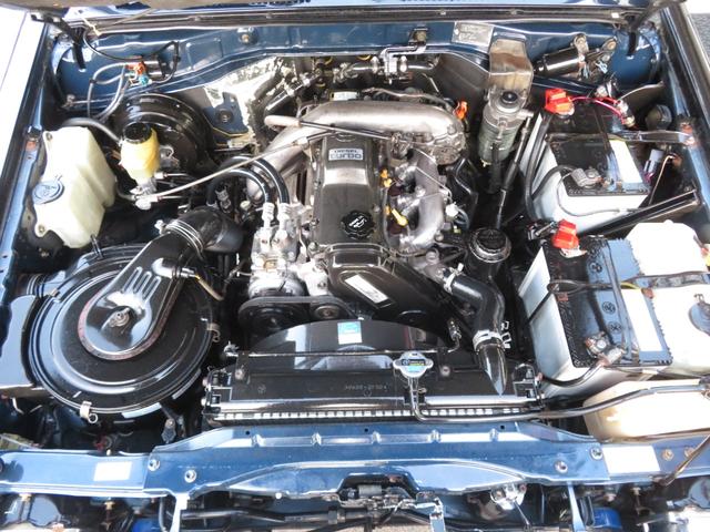 ランドクルーザープラド SXワイド 当社ユーザー買取車 全塗装済黒 新品グリル 社外レンズ 2インチUP 社外ショック 社外AW MTタイヤ 社外マフラー ナルディハンドル シートカバー 社外ナビ Bカメラ ドラレコ ETC キーレス(8枚目)