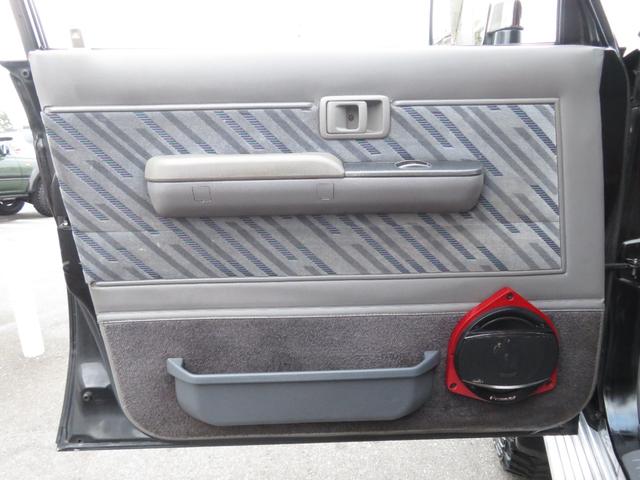 ランドクルーザープラド SXワイド 当社ユーザー買取車 全塗装済黒 新品グリル 社外レンズ 2インチUP 社外ショック 社外AW MTタイヤ 社外マフラー ナルディハンドル シートカバー 社外ナビ Bカメラ ドラレコ ETC キーレス(18枚目)