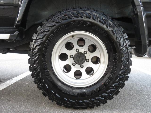 ランドクルーザープラド SXワイド 当社ユーザー買取車 全塗装済黒 新品グリル 社外レンズ 2インチUP 社外ショック 社外AW MTタイヤ 社外マフラー ナルディハンドル シートカバー 社外ナビ Bカメラ ドラレコ ETC キーレス(26枚目)