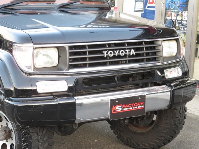 ランドクルーザープラド SXワイド 当社ユーザー買取車 全塗装済黒 新品グリル 社外レンズ 2インチUP 社外ショック 社外AW MTタイヤ 社外マフラー ナルディハンドル シートカバー 社外ナビ Bカメラ ドラレコ ETC キーレス(30枚目)