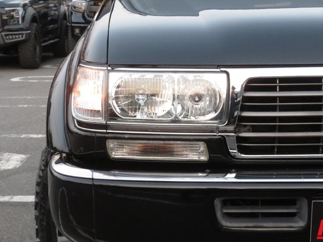 ランドクルーザー８０ ＶＸリミテッド　中期モデル　全塗装済黒　新品ヘッドライト　クリスタルレンズ　３インチＵＰ　社外ショック　プロコンプ製１６インチＡＷ　新品ＴＯＹＯ製ＭＴタイヤ　社外マフラー　シートカバー　社外ナビ　バックカメラ　ＥＴＣ（17枚目）