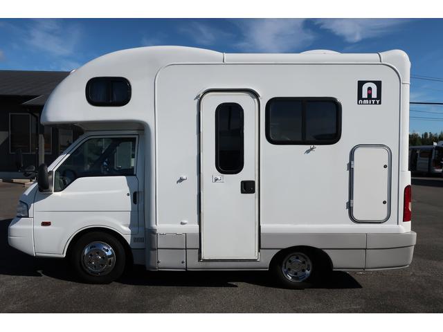 キャンピングカー AtoZ アミティ 7名乗車 シンク 冷蔵庫 FFヒーター リヤクーラー サブBT ルーフベント シンク兼用アウターシャワー 常設2段ベッド ETC 外部電源 テーブル カーテン DCソケット(24枚目)