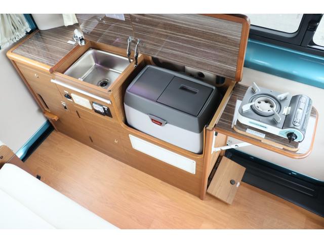 ＮＶ２００バネットバン キャンピングカー広島　ポップコンｅＥ　ポップアップルーフ／ＦＦヒーター／フレキシブルソーラーパネル／冷蔵庫／シングルサブ／走行充電／外部充電／４００Ｗインバーター／ナビ切替ＳＷ／網戸／メモリーナビ／バックカメラ／ＥＴＣ／キャンピングカー（8枚目）