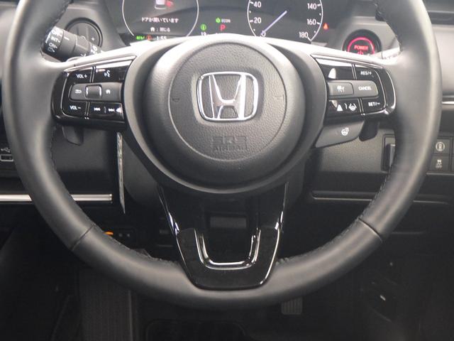 ヴェゼル e:HEVZ Sヒータ 地デジフルセグTV 定期点検記録簿 電動テールゲート サイドエアバッグ 後カメラ 横滑防止装置 エアコン LEDヘットライト パワステ USB接続 ナビTV エアバック(4枚目)