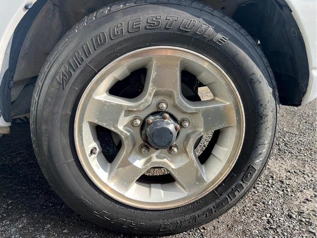 ジムニー ＸＣ　４ＷＤ　ＨＤＤナビ　ＤＶＤ再生　キーレスエントリー　背面タイヤ　ハードカバー付　純正アルミホイール　オートマ車（18枚目）