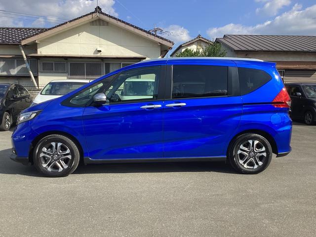 フリード クロスター 当社レンタカー 純正9インチナビ ドライブレコーダー フルセグTV ETC LEDヘッドライト+LEDアクティブコーナーリングライト オートエアコン 両側パワースライドドア ホンダセンシング 禁煙車(5枚目)